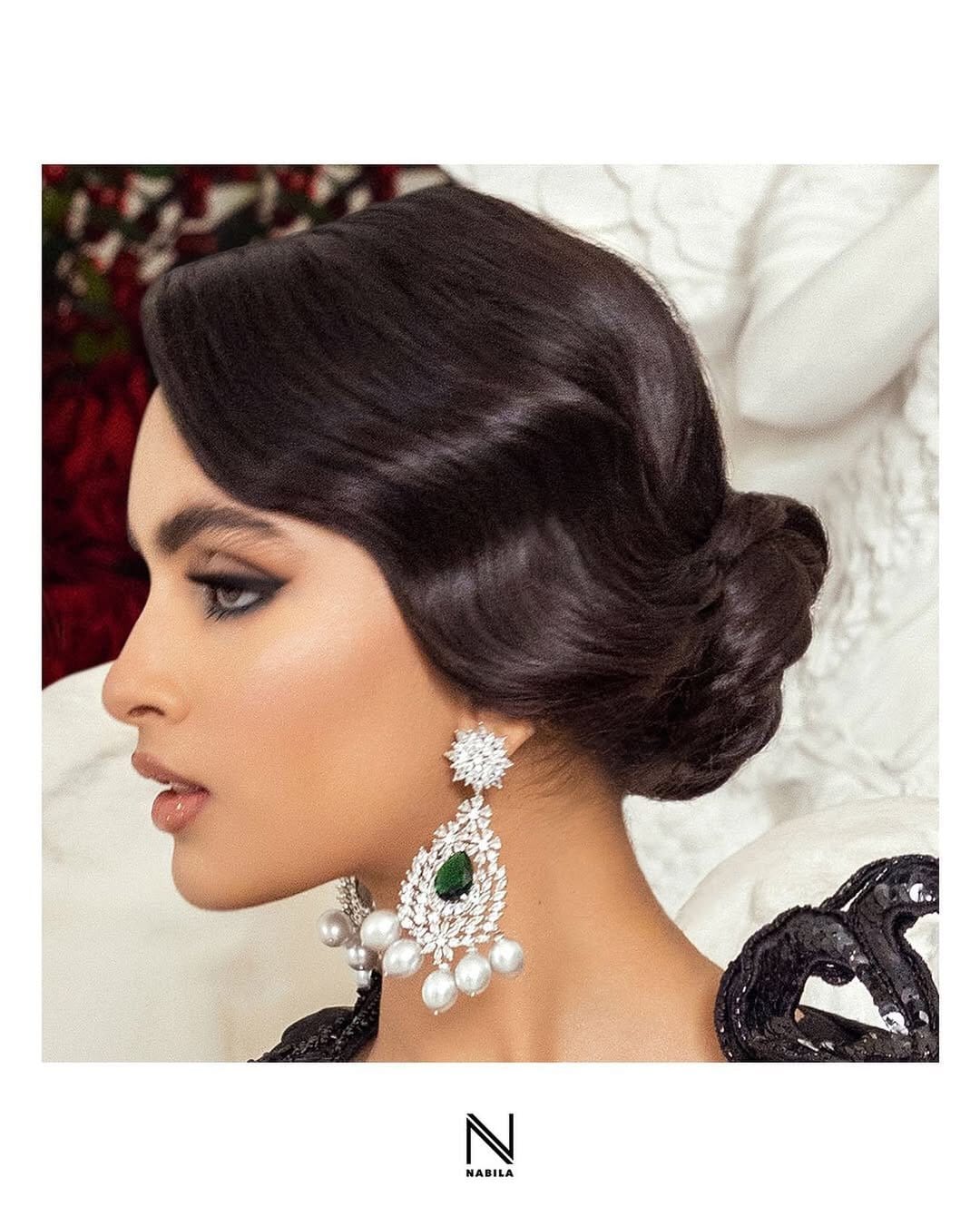 Side-swept bun with sparkling gem accents