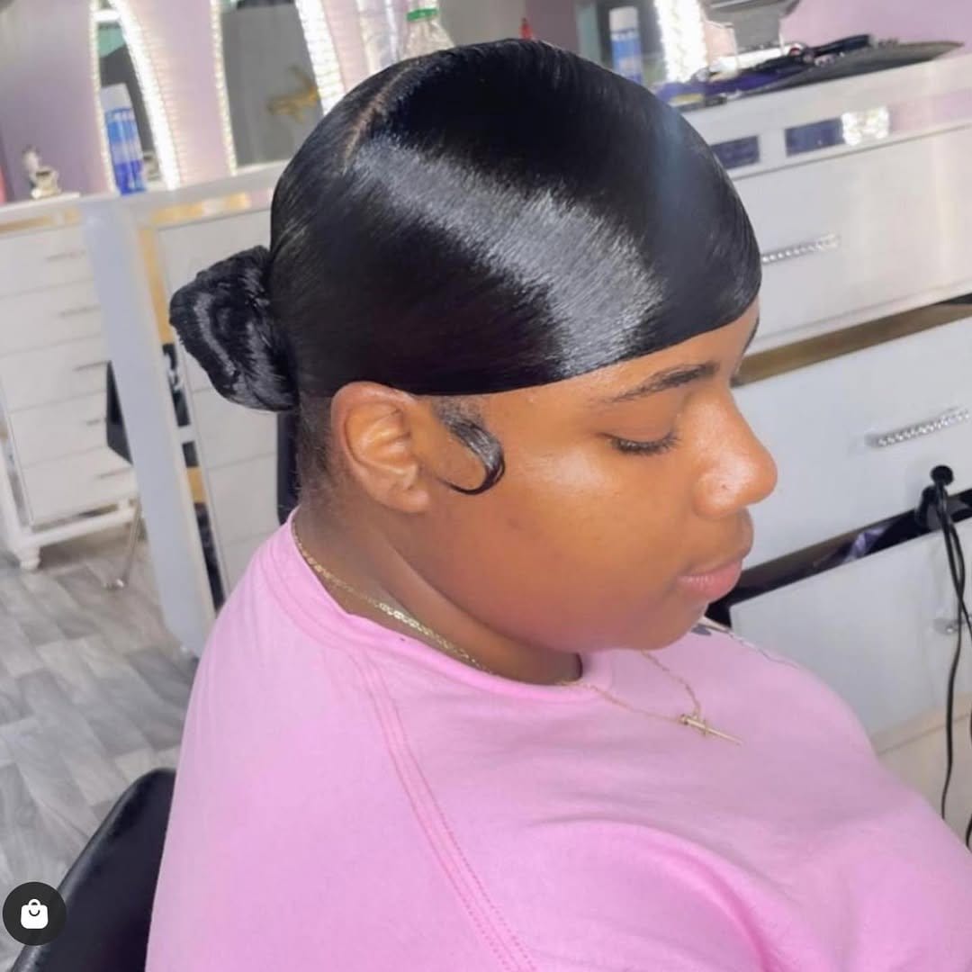 Low ponytail with a deep side part