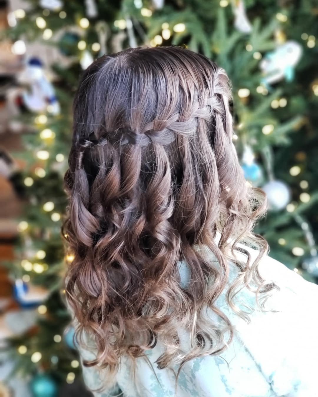 Graceful waterfall braid with cascading curls