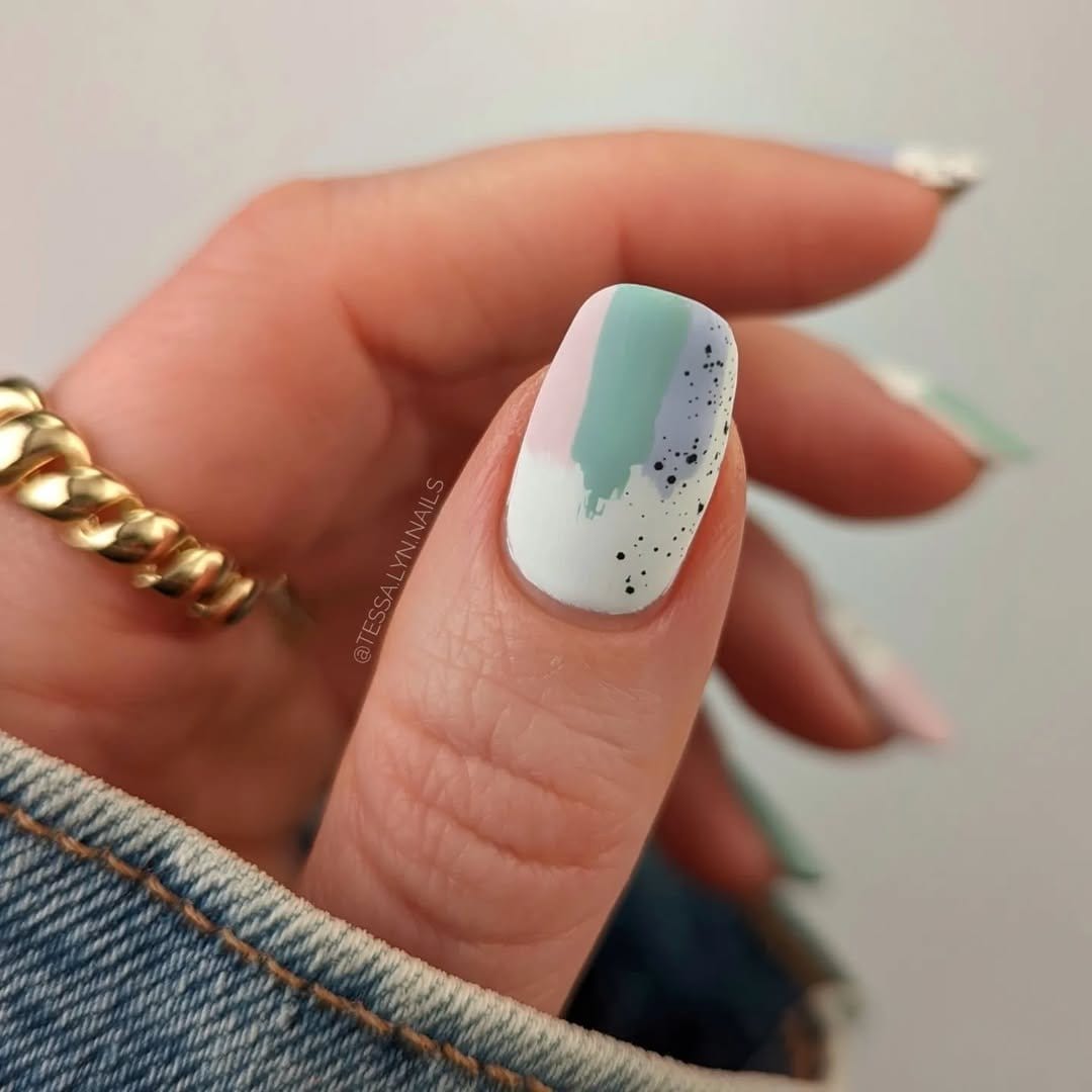 Speckled egg nail art with pastel colors