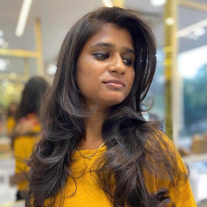 Side-swept bangs with sleek finish