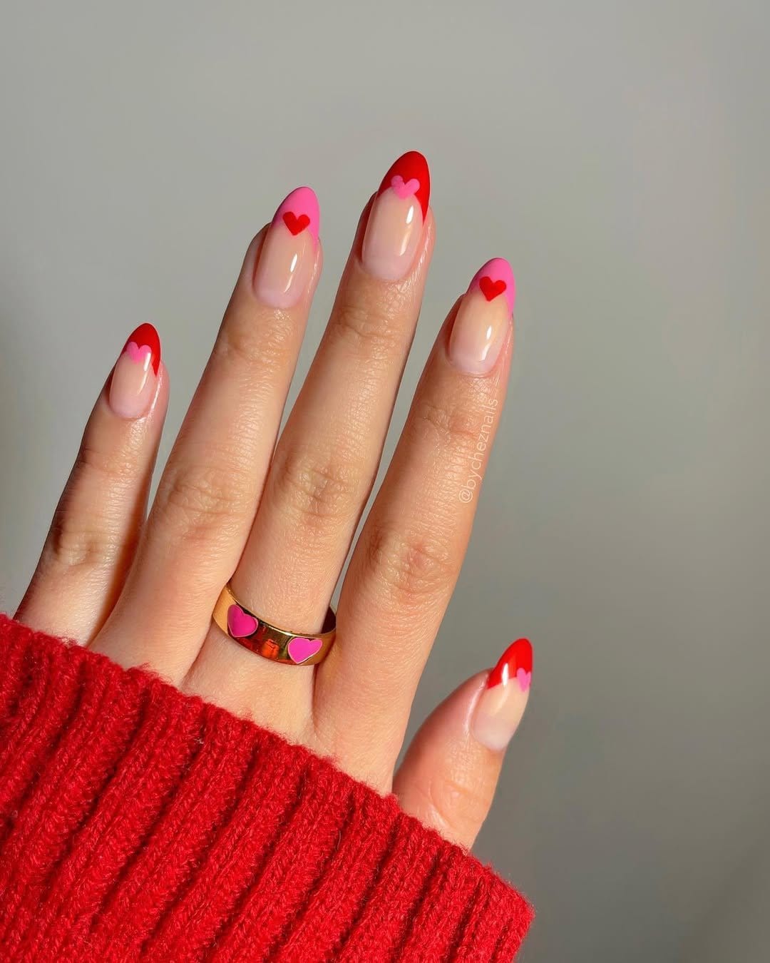 Heart-accented French tip nails in romantic design