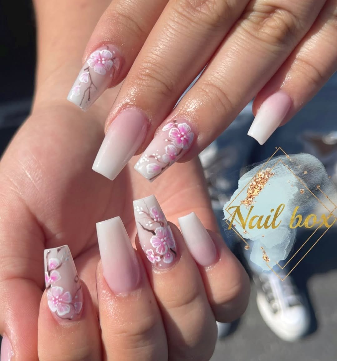 Cherry blossom nail art on a light background