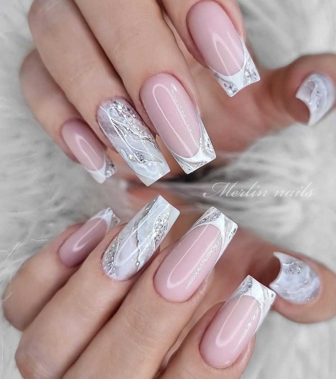 Marble effect French tip nails in swirled patterns