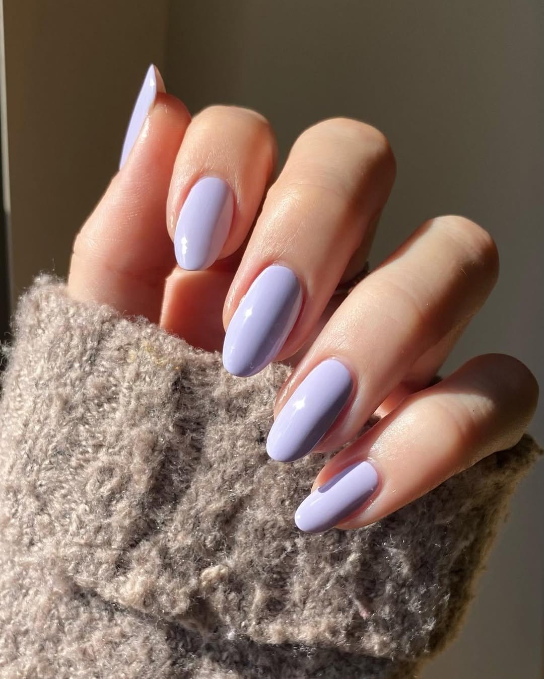 Lavender flower nail art on pastel purple background