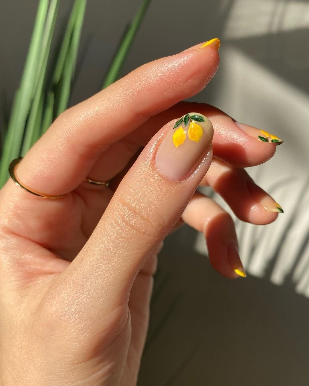 Yellow nails with citrus fruit art