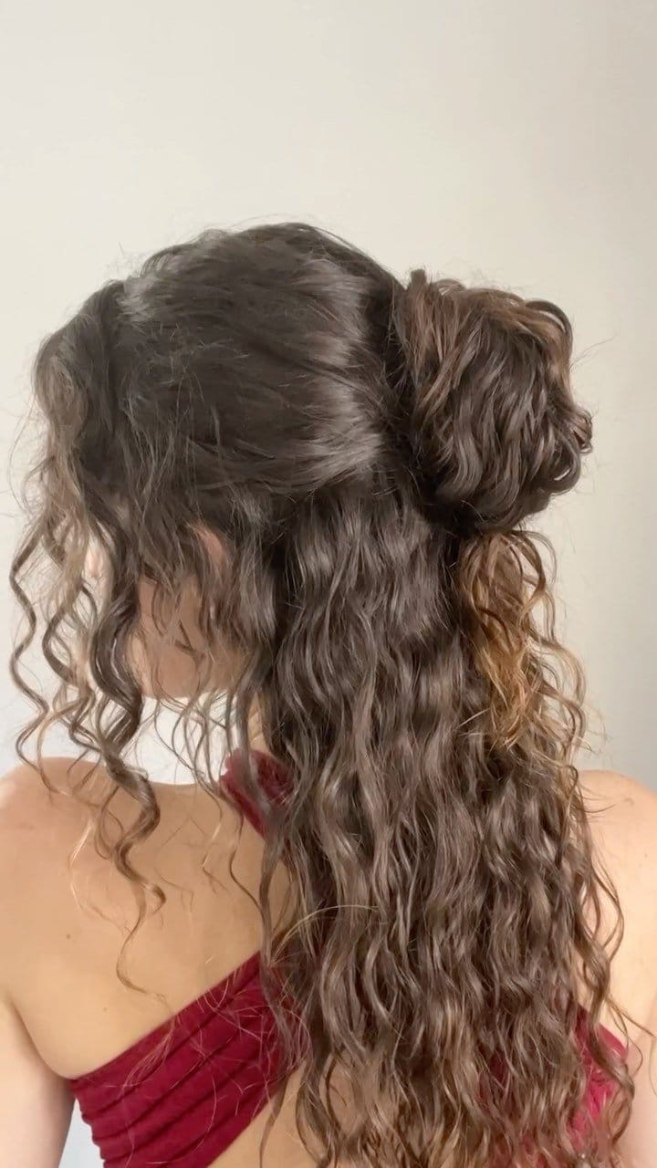 Tousled wavy hair with butterfly clip
