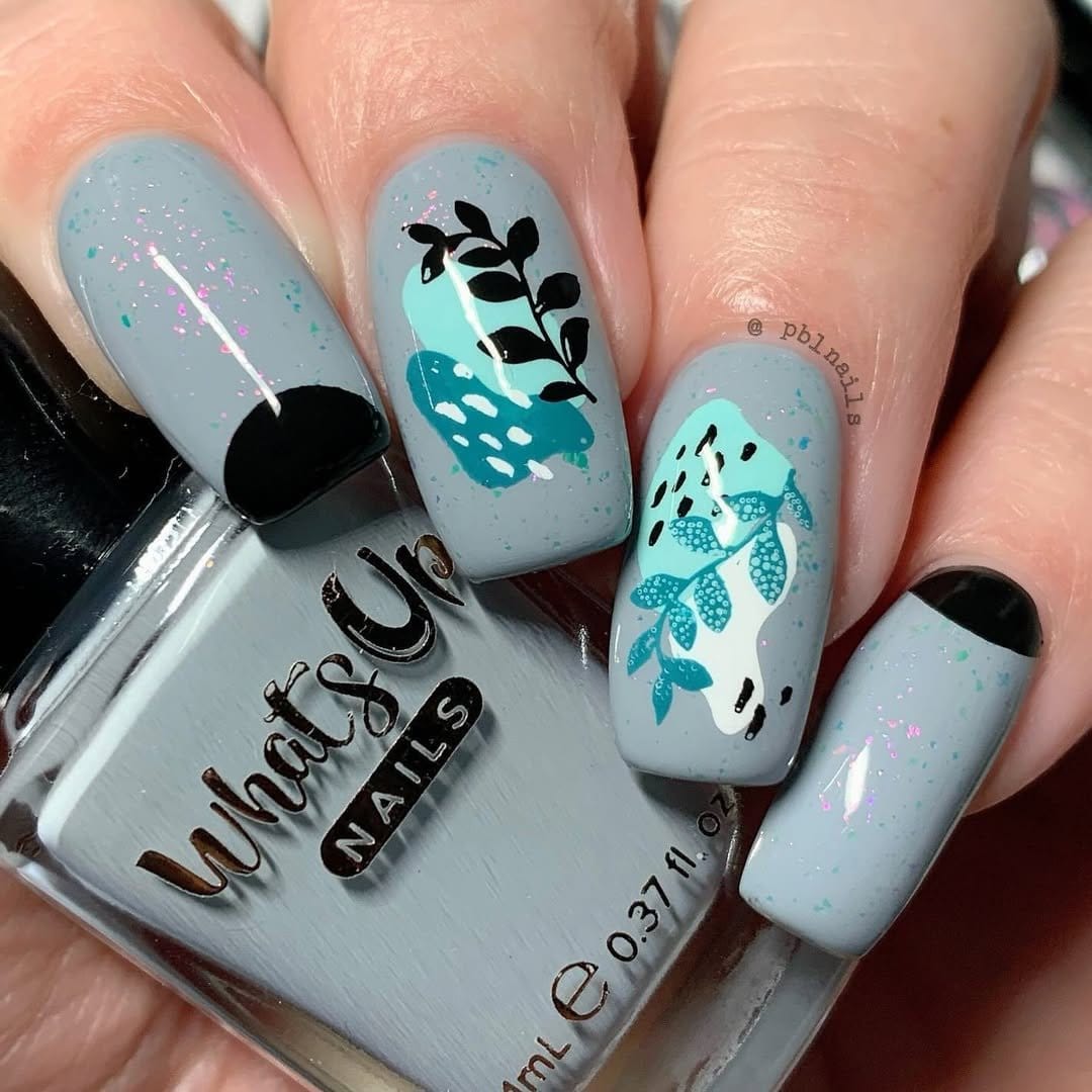 Vibrant butterfly nail art on gradient background