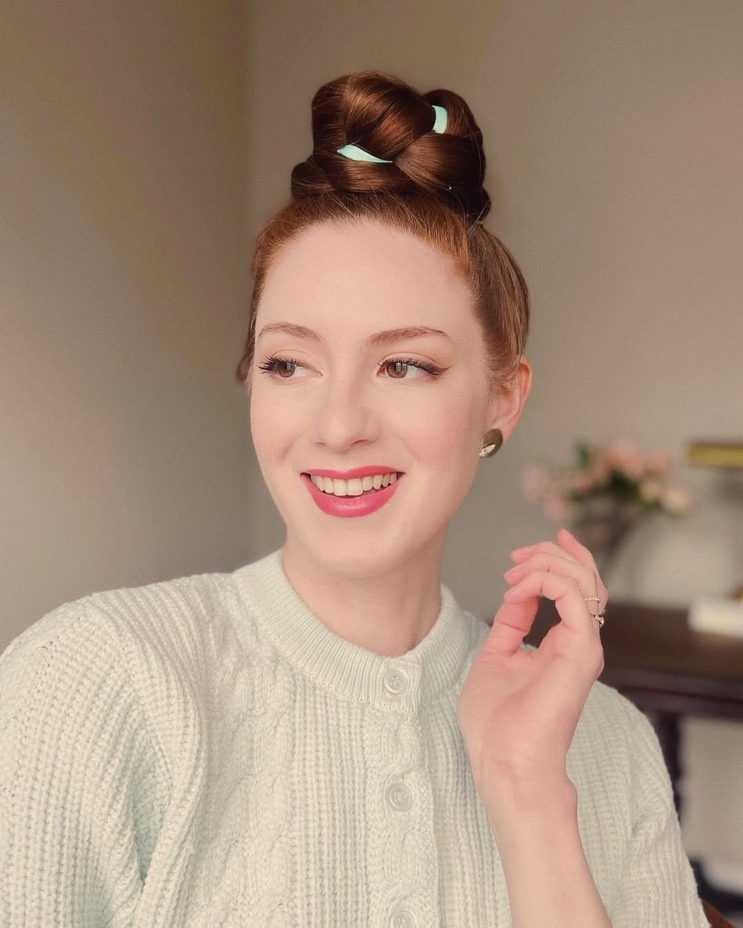 Beehive bouffant hairstyle with pearl headband