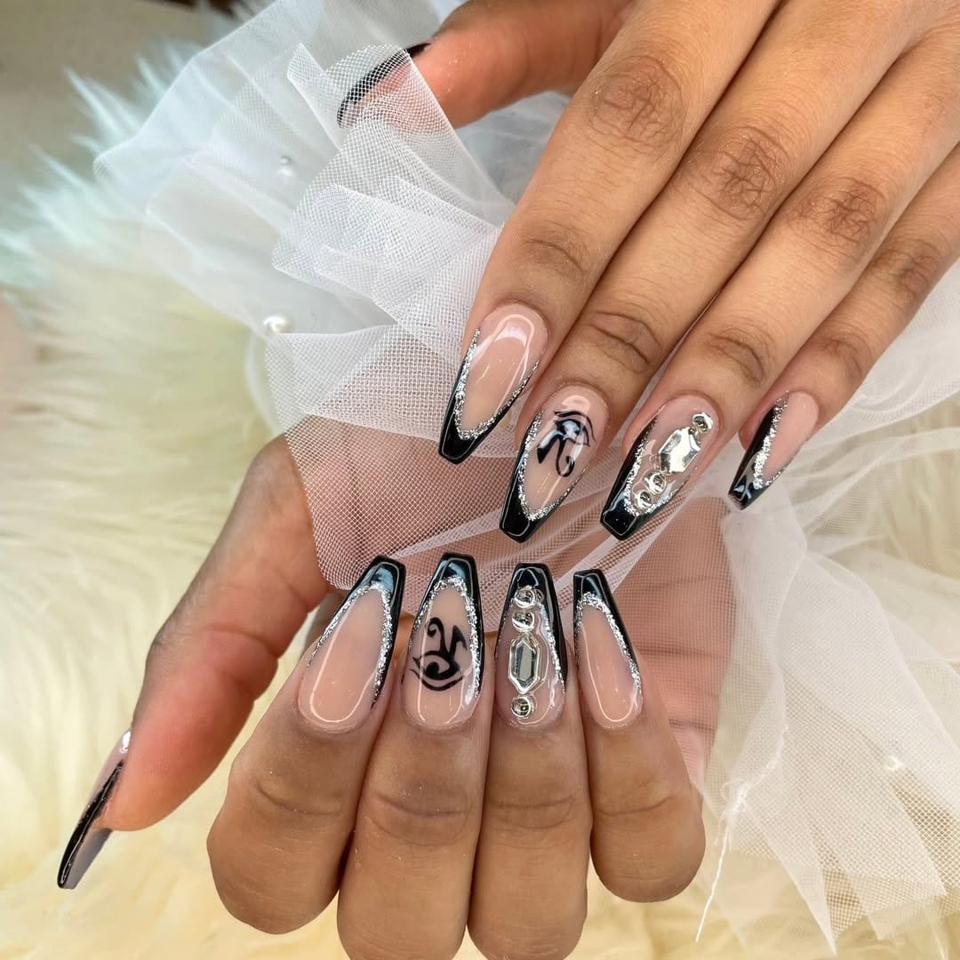 Black French tip nails adorned with rhinestones