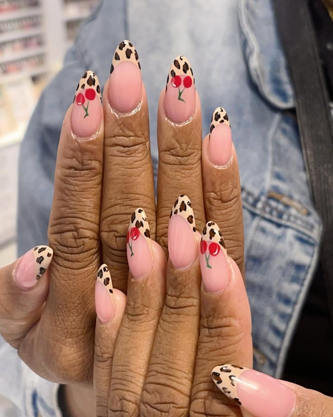 Animal print French tip nails in leopard design