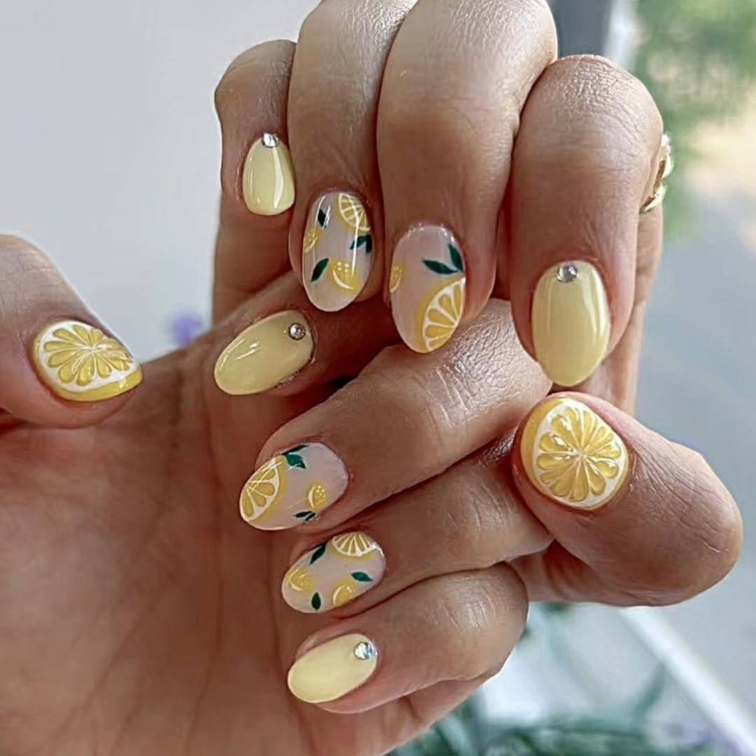 Shiny lemon yellow polished nails