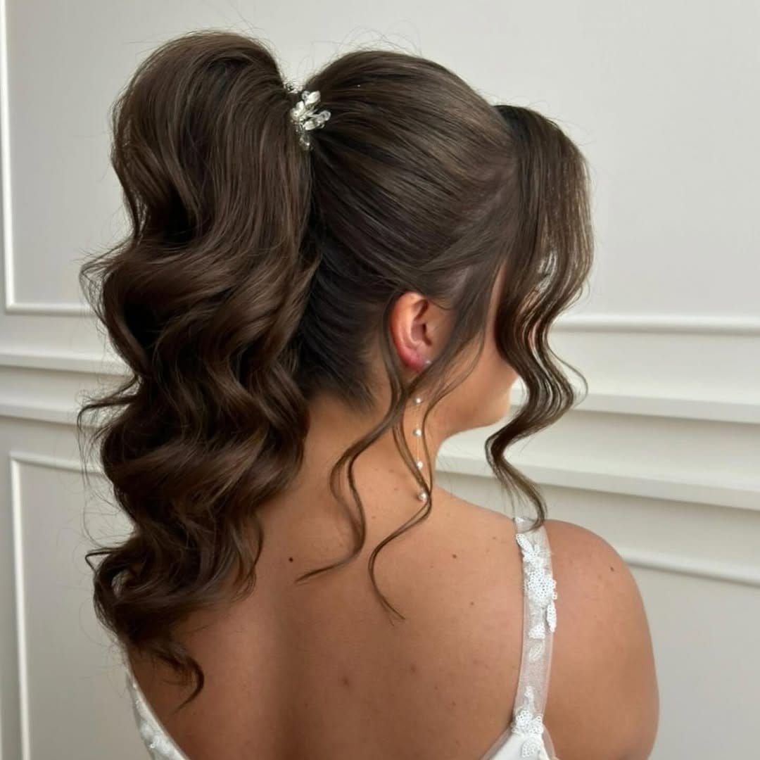 High ponytail with cascading wavy hair