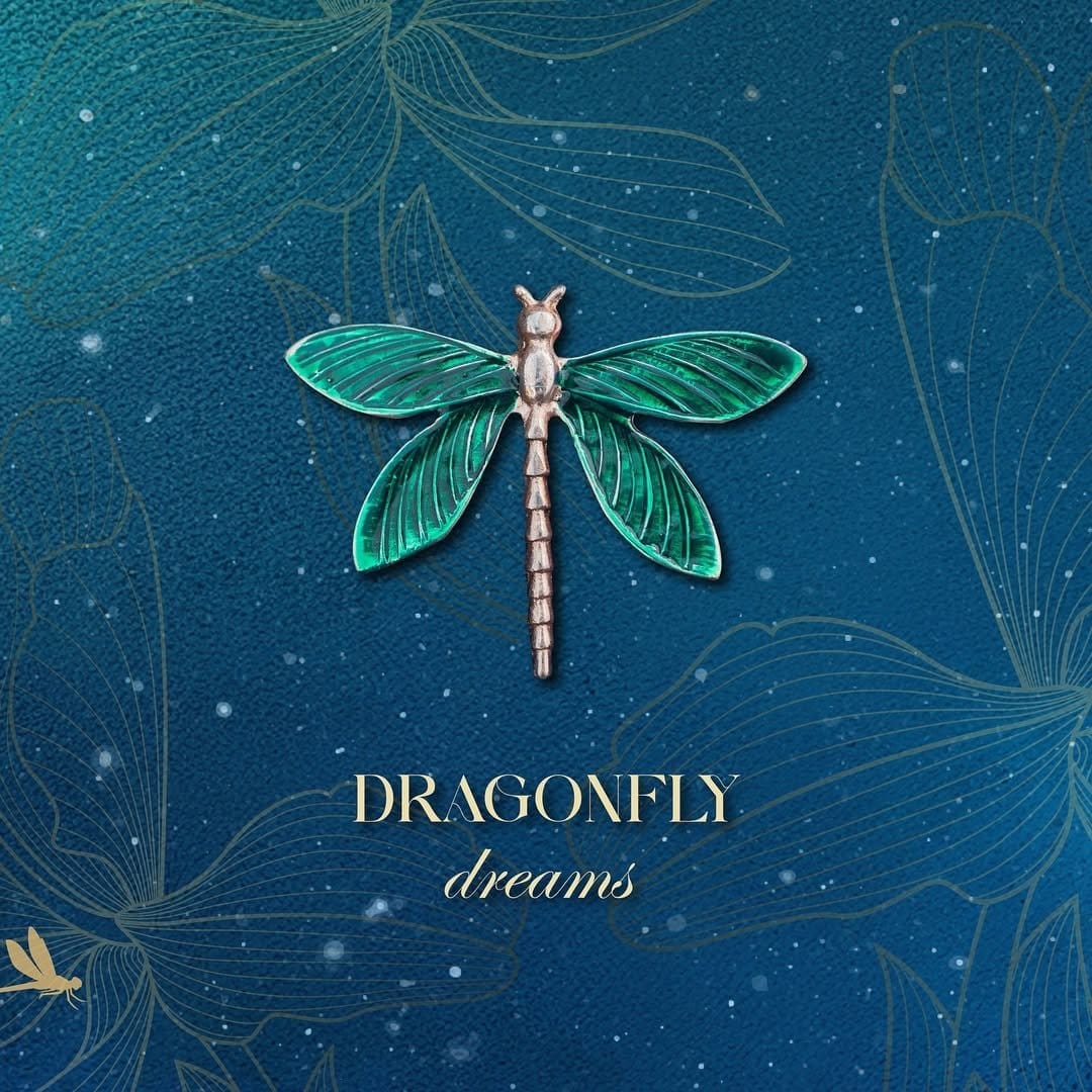 Delicate dragonfly nail art with metallic accents