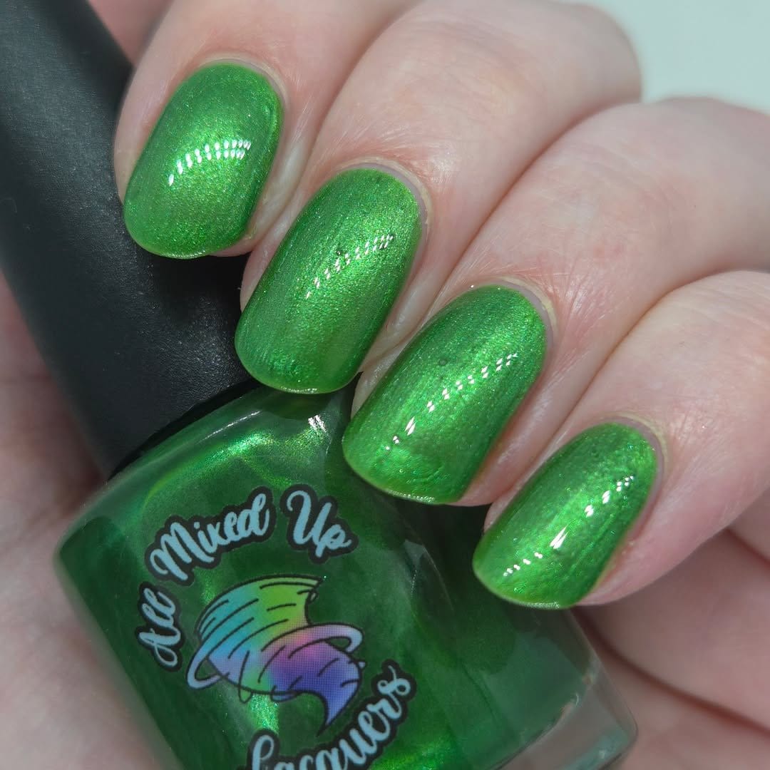 Peacock feather nail art with vibrant colors