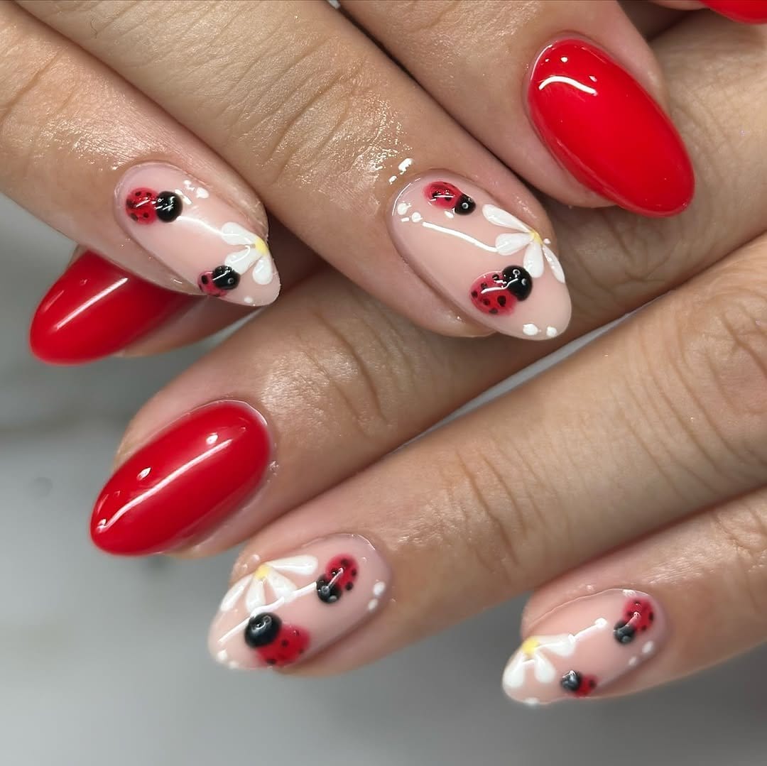 Ladybug nail art with red and black dots