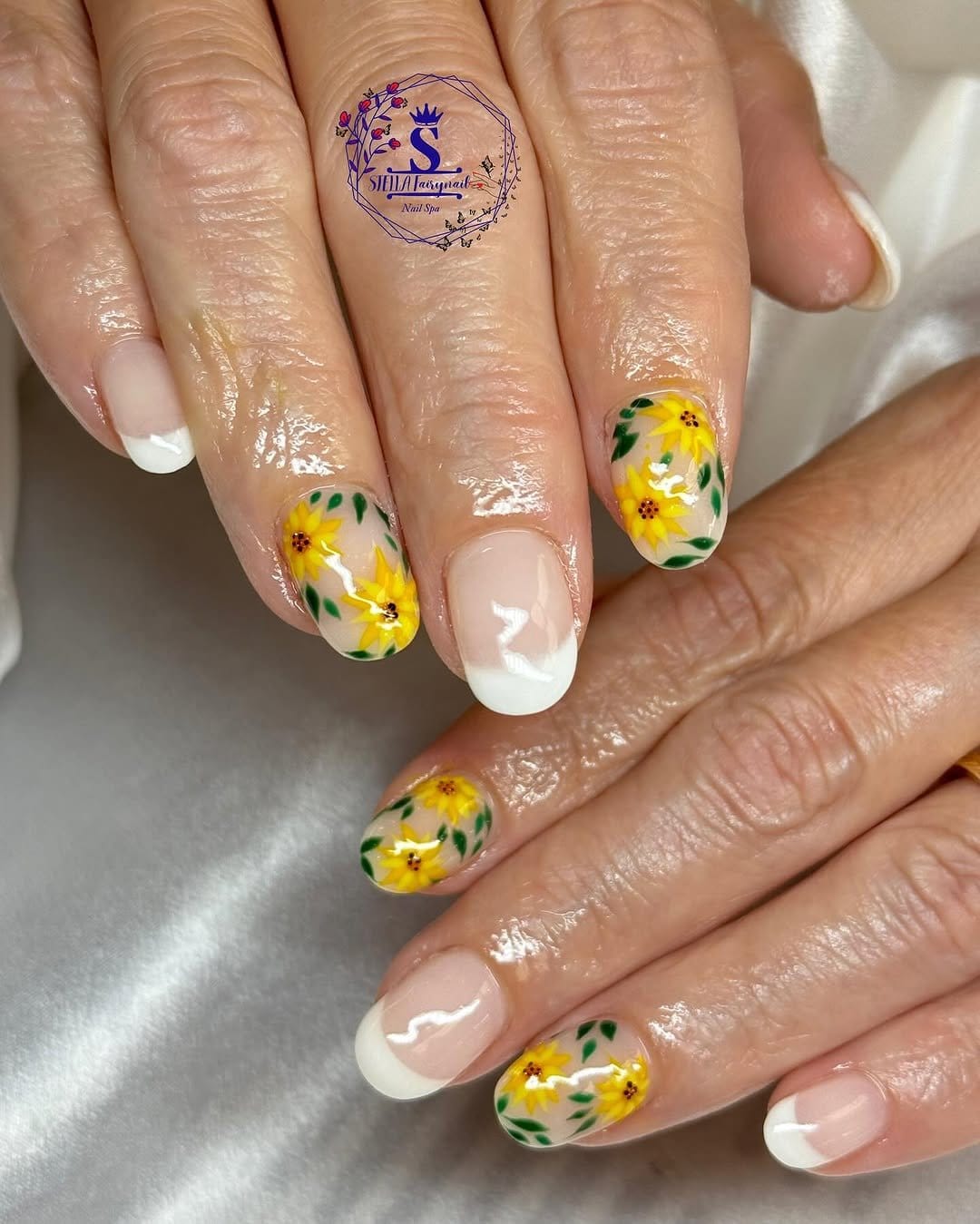 Sunflower pattern French tip manicure