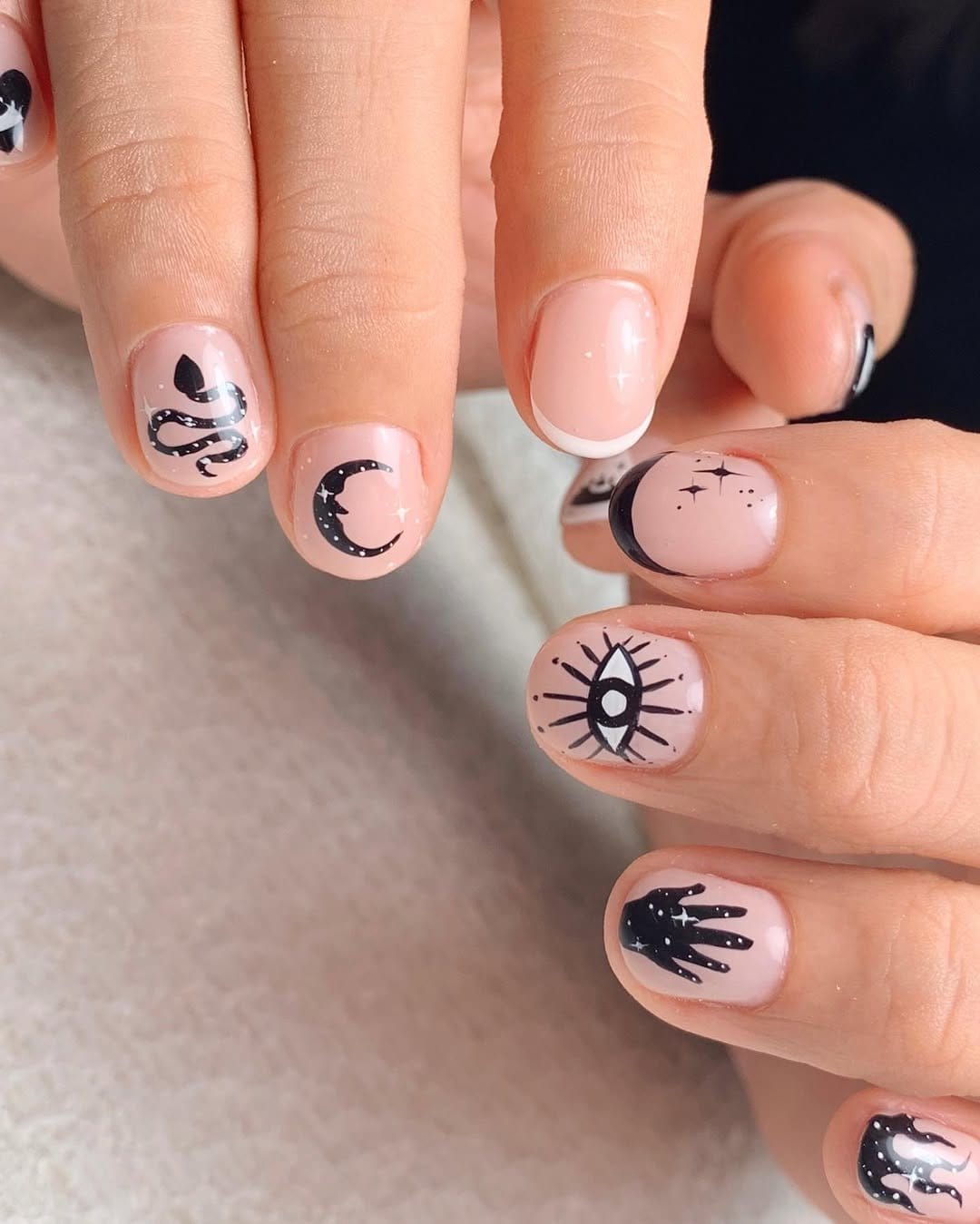 Striped pastel nail art on neutral background