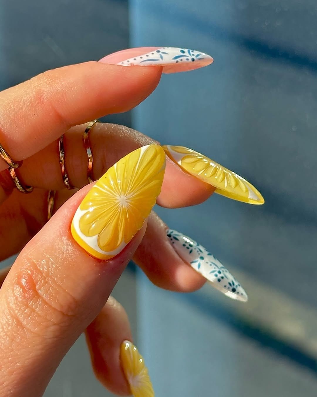 Lemon zest-inspired nail art with yellow and green