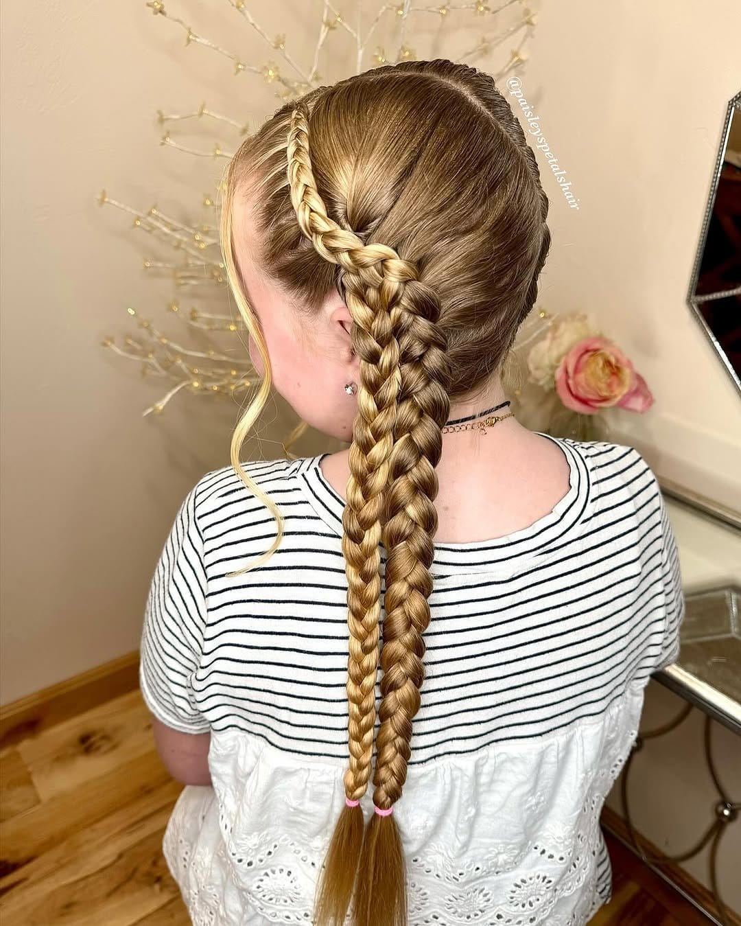 Playful double Dutch braids with colorful ribbons