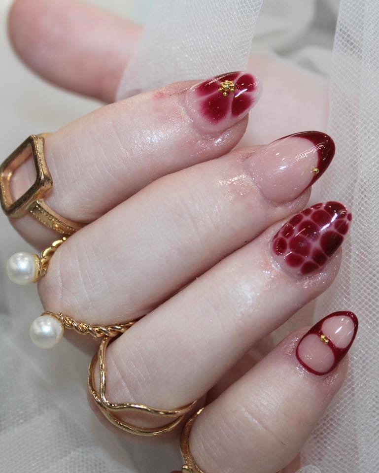 Watercolor effect French tip nails in artistic design