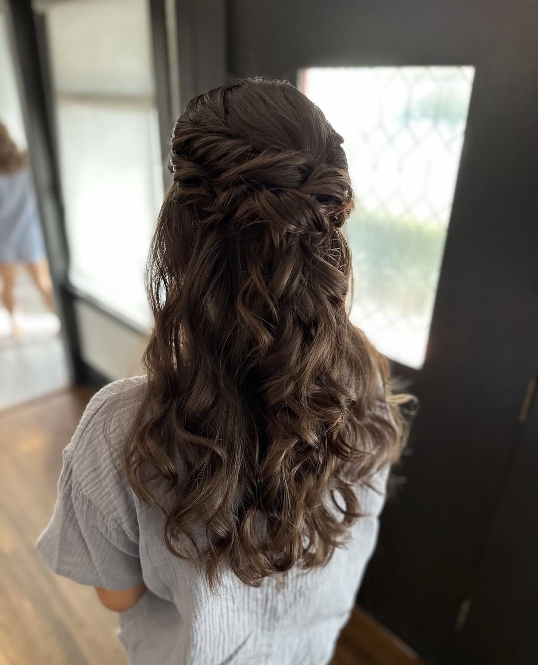 Twisted half-up hairstyle with volume