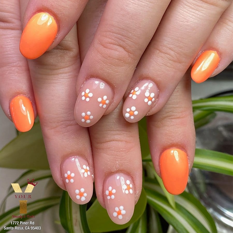 Dainty daisy nail design with yellow centers