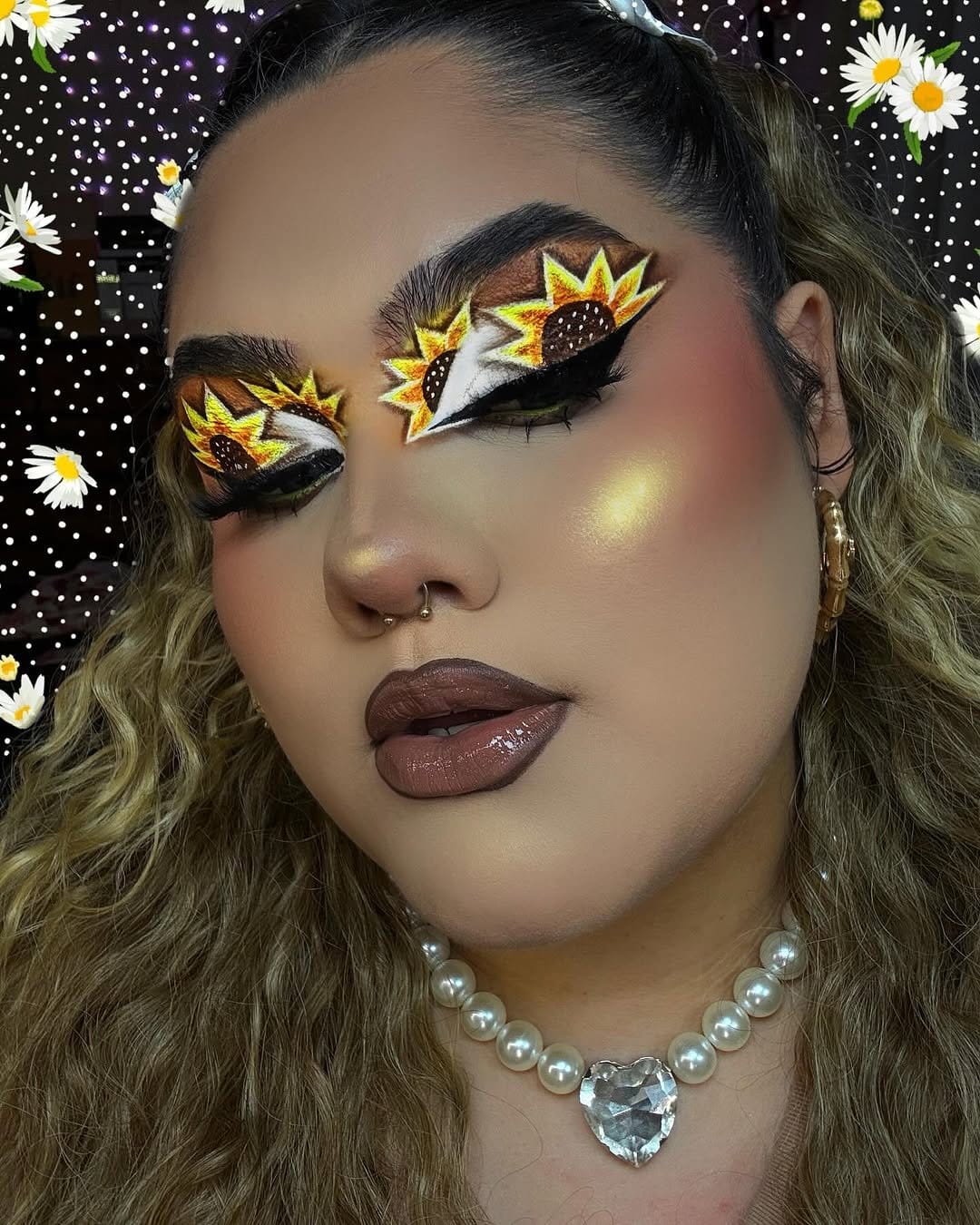 Glitter sunflower nail art with gold accents