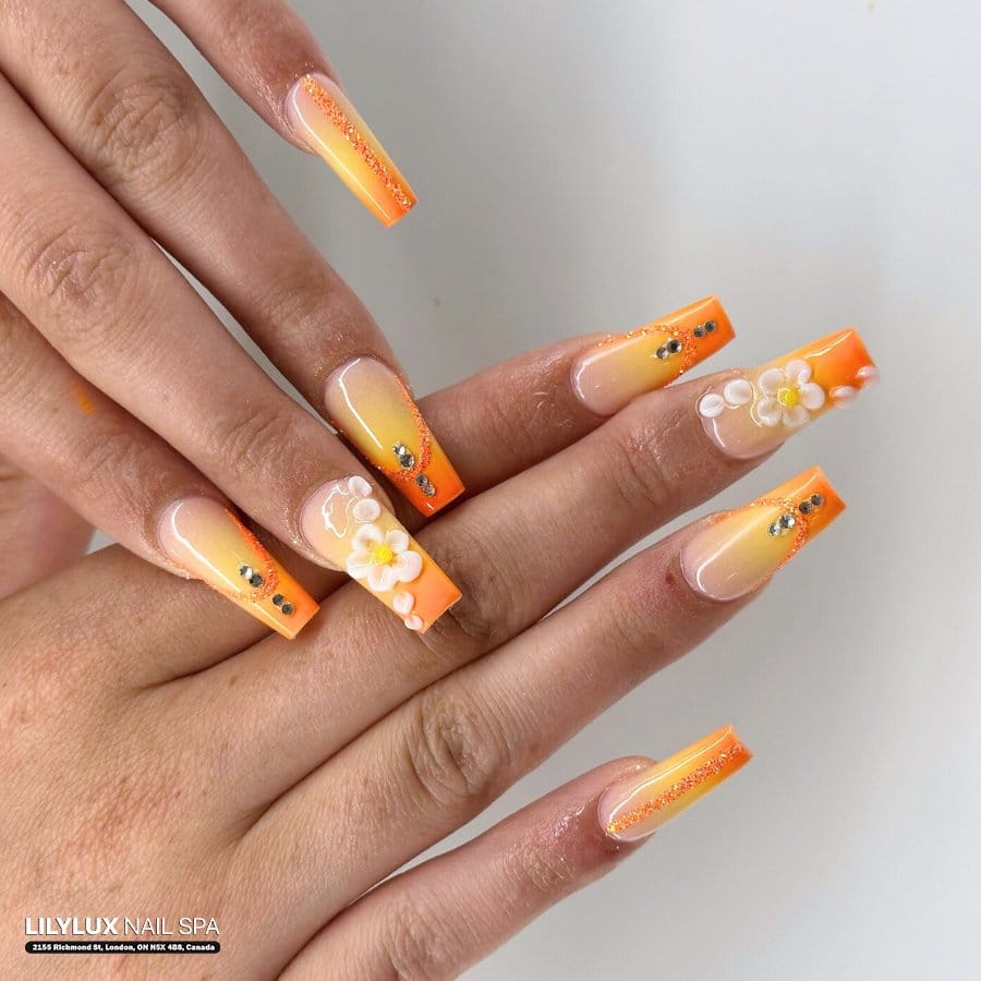 Metallic striped nail art with sunflower designs