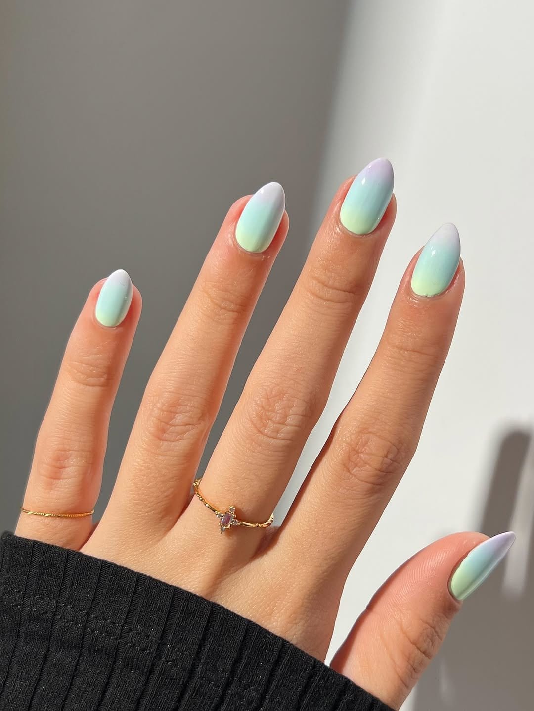 Green gradient nail art resembling dewy grass