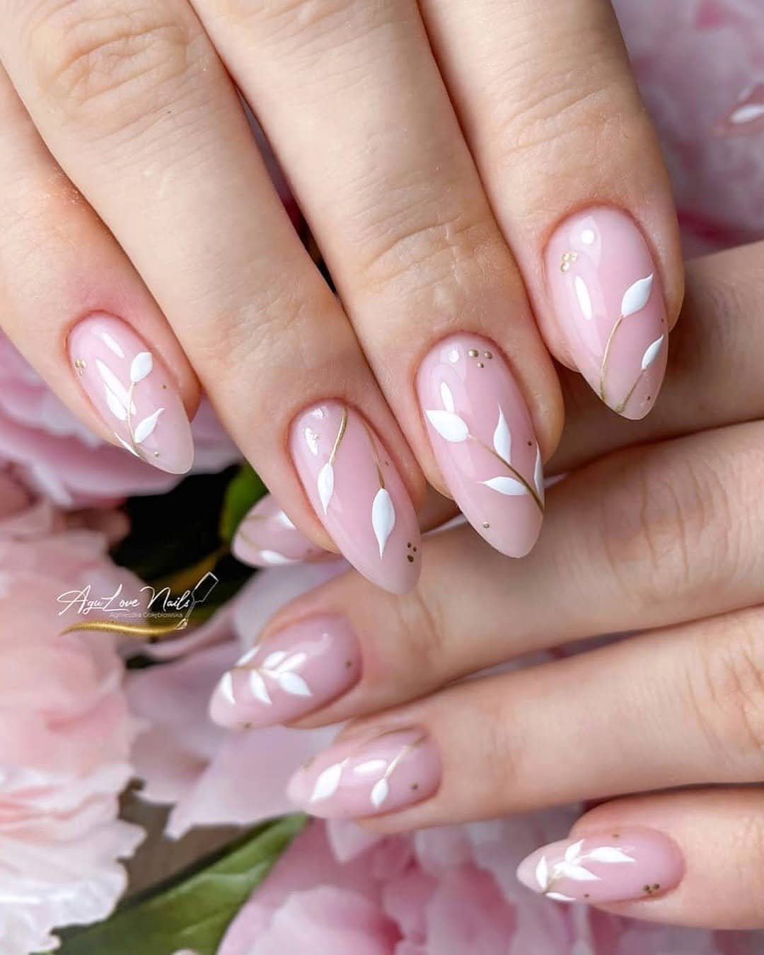 Coral pastel nails with gold leaf accents