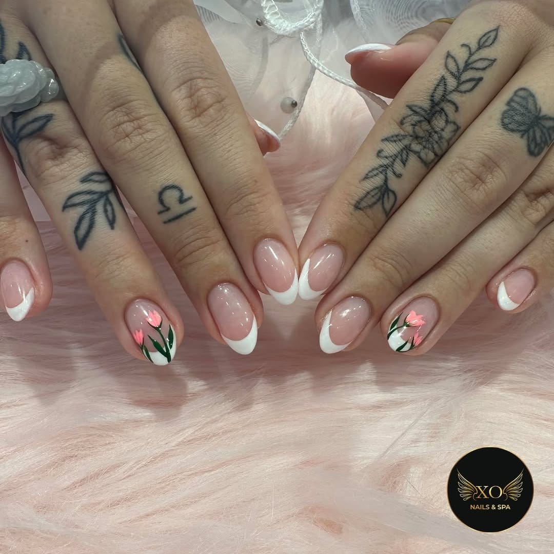 Tulip nail art in pink and green on nude background