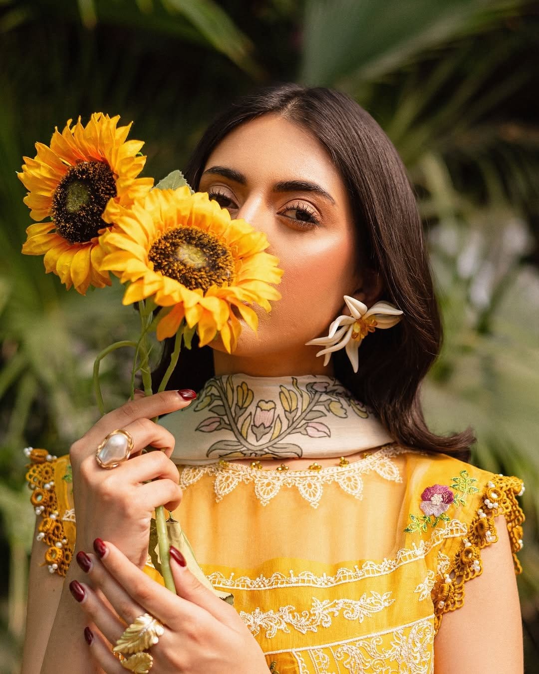Classic sunflower nail art with yellow petals and brown center