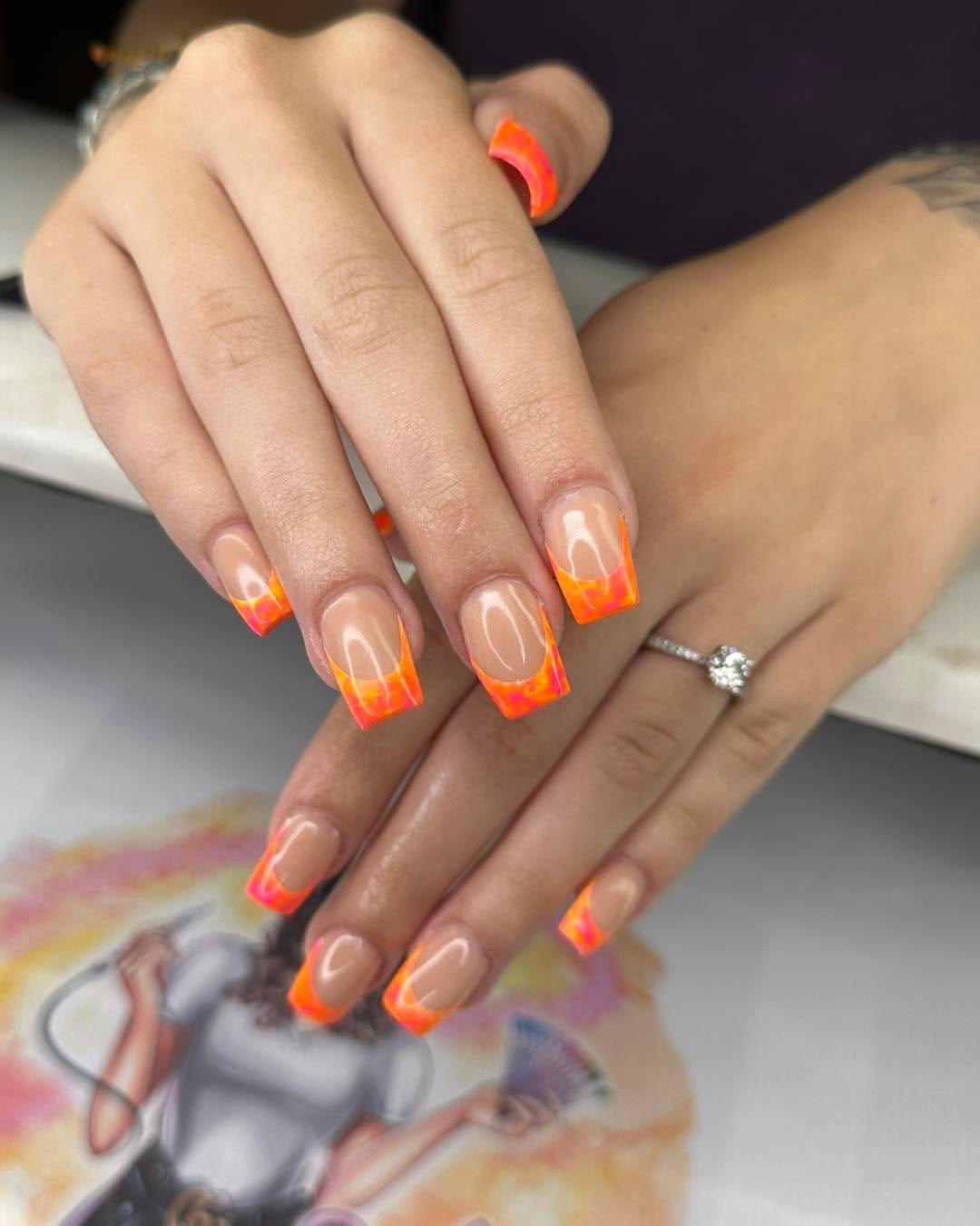Neon French tip nails in vibrant colors
