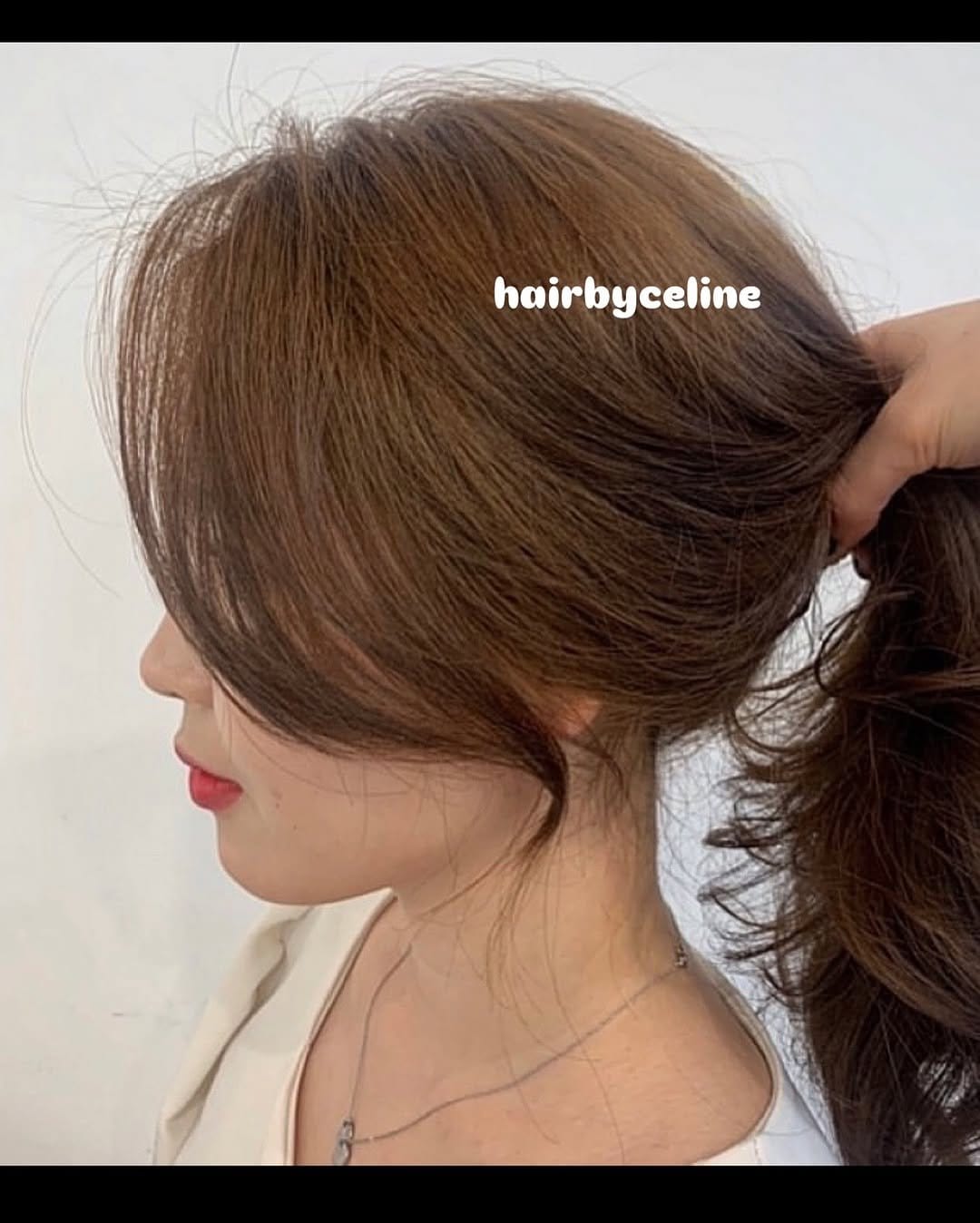 High ponytail with curtain bangs