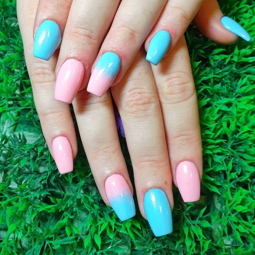 Gradient pastel ombre French tips transitioning from pink to blue