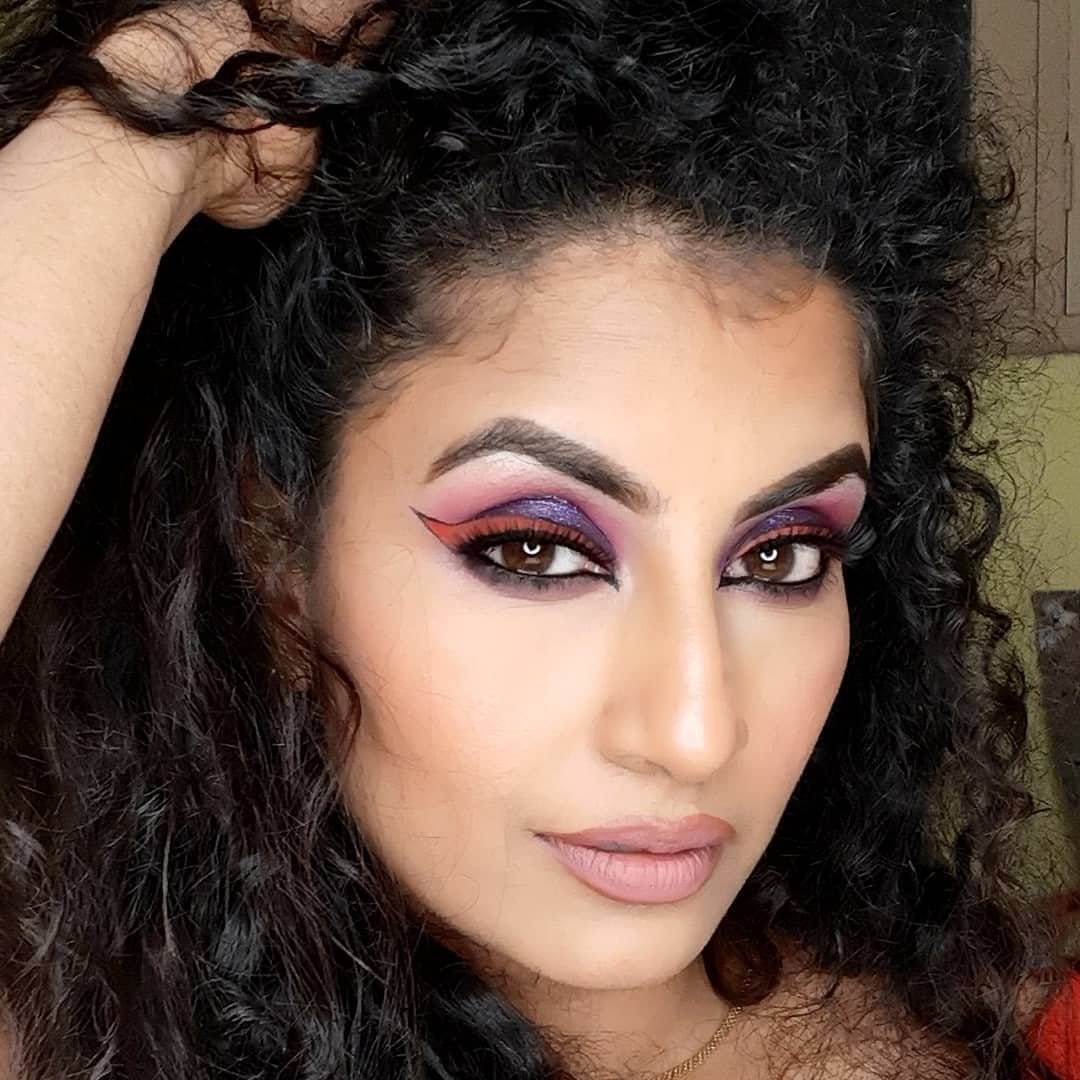 Bold smokey eye with high-shine red lips