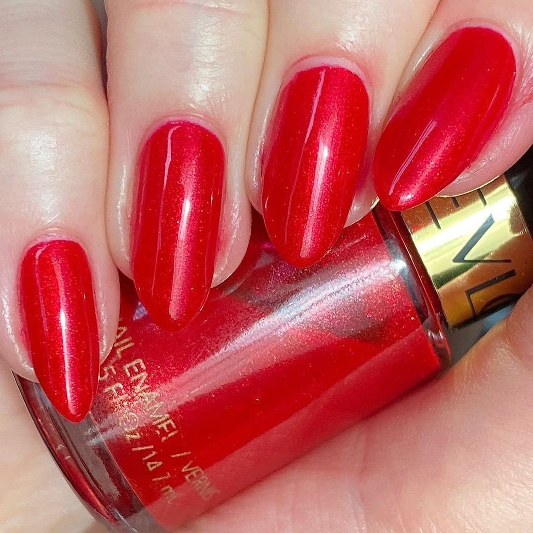 Vibrant berry lipstick and matching nail polish