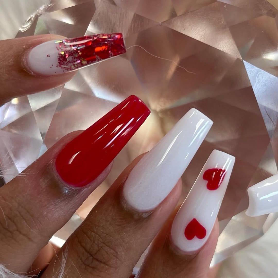 Red ombre nails with cute heart designs
