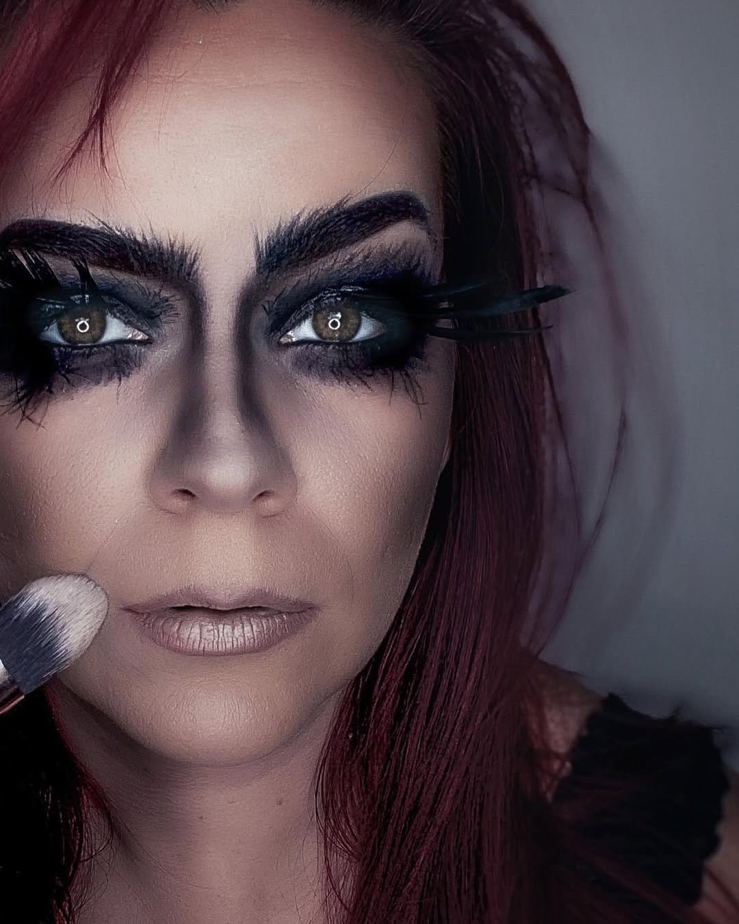 Dramatic smokey eye with feathered eyelash extensions