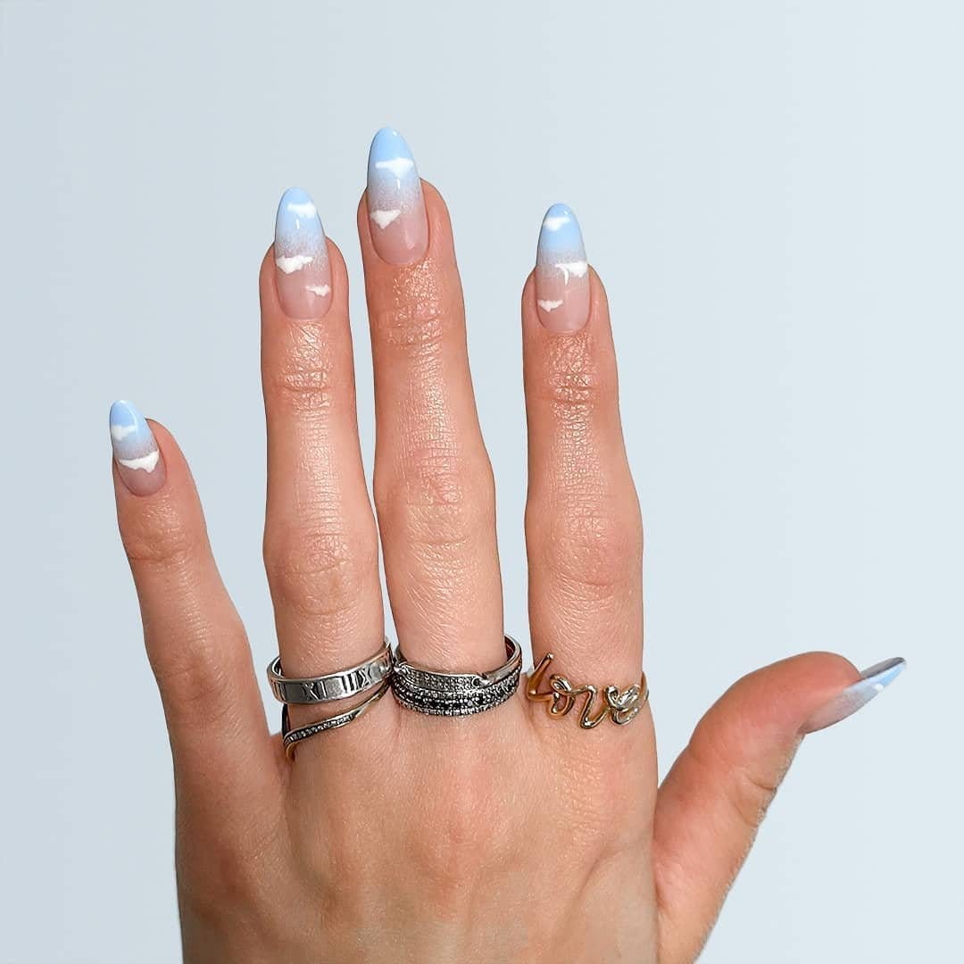 Tranquil pastel sky blue ombre nails under the sky