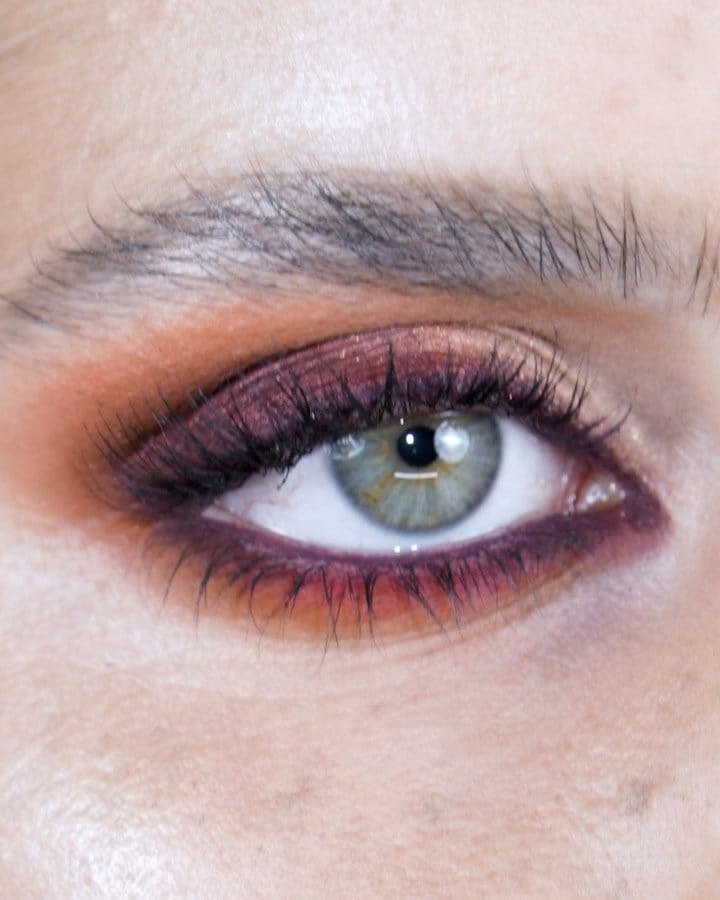 Deep burgundy smokey eye with defined brows