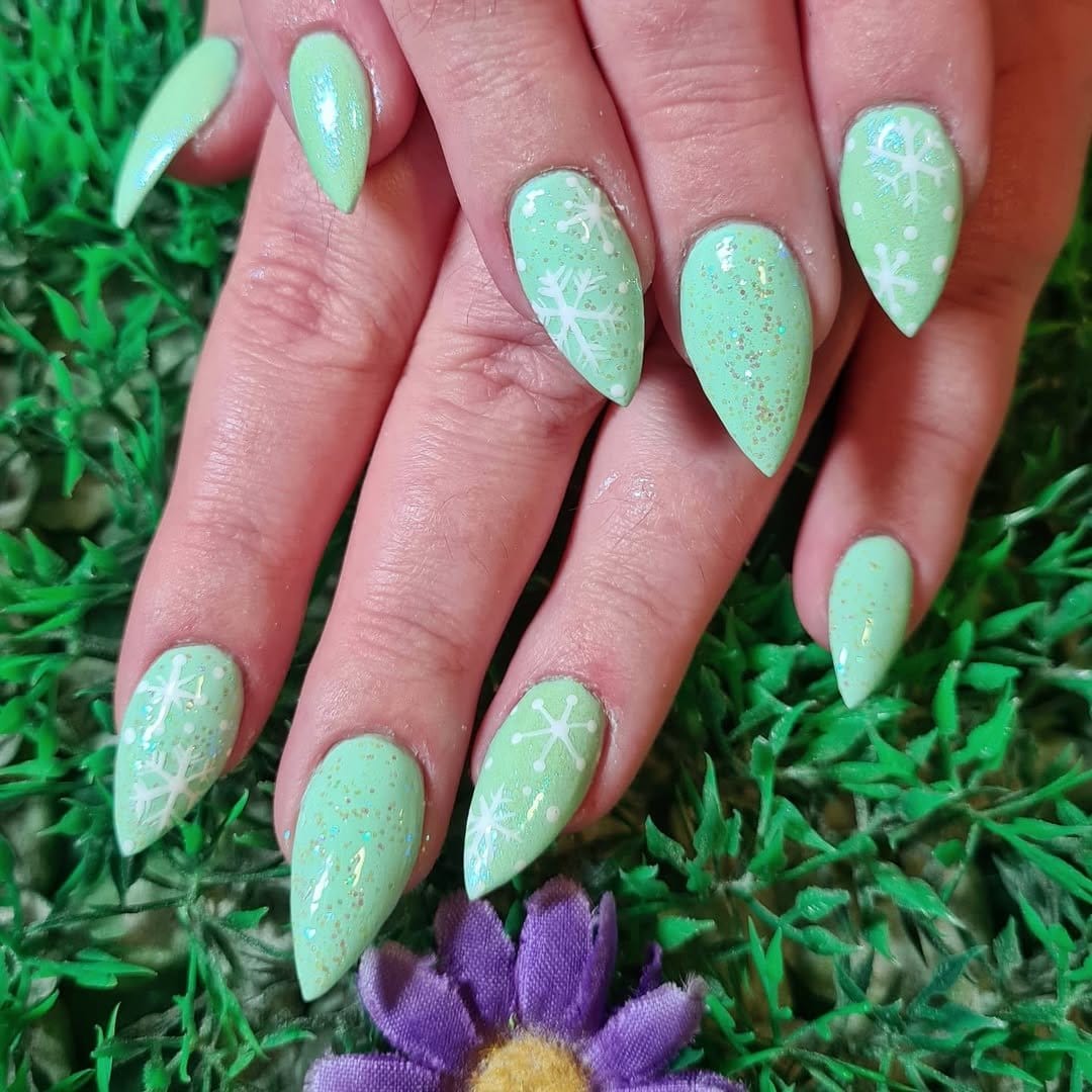 Seafoam green nails with wave patterns