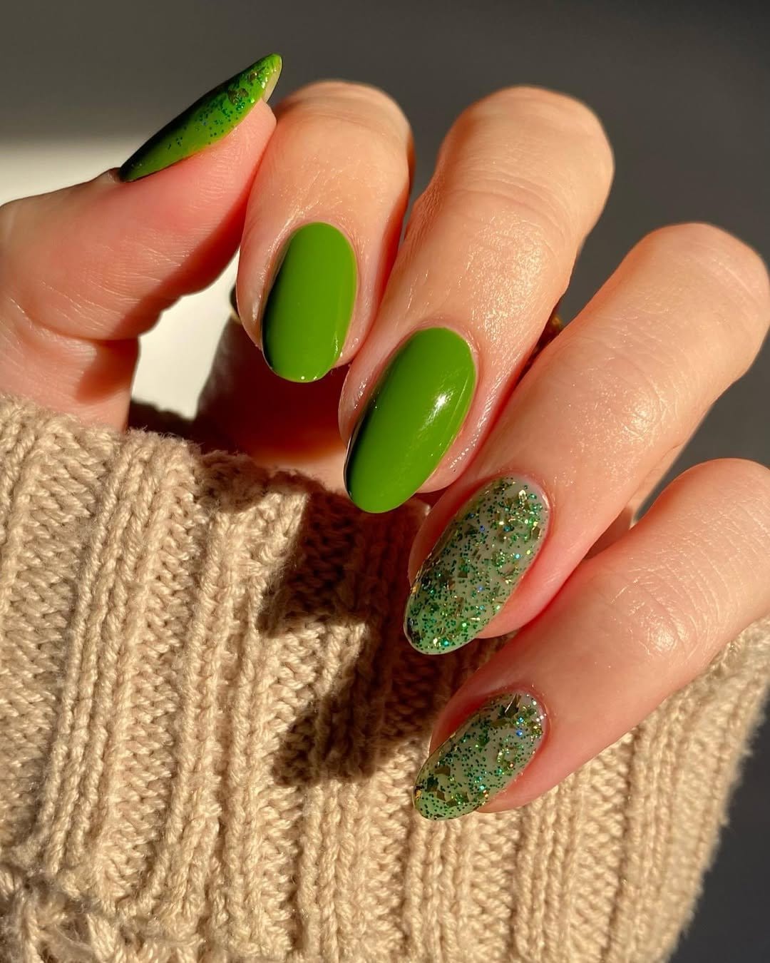 Sage green pastel nails with gold leaf