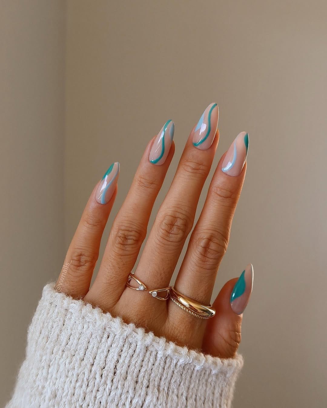 Asymmetrical pastel lines on clear nails