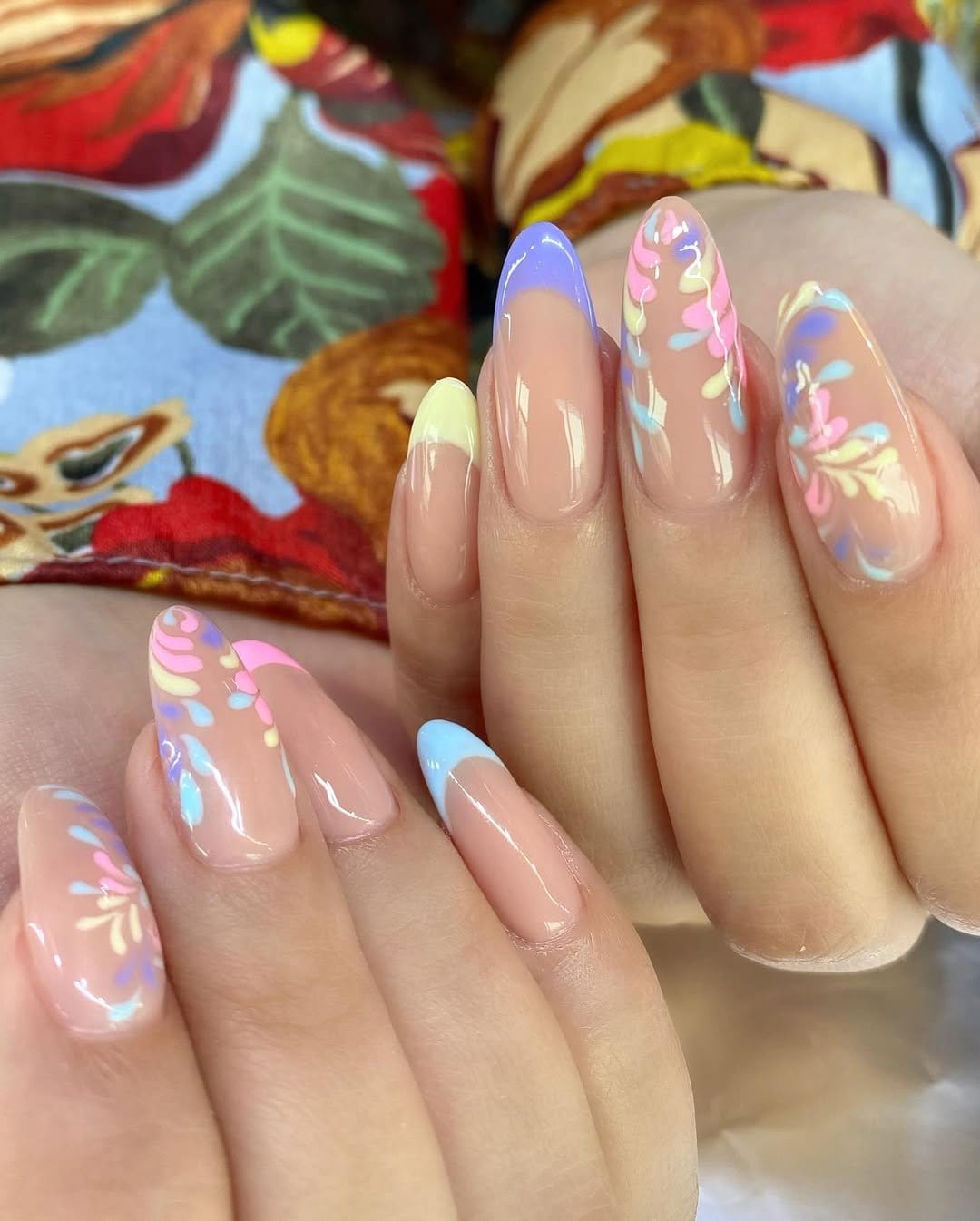 Pastel rainbow nails with floral accents