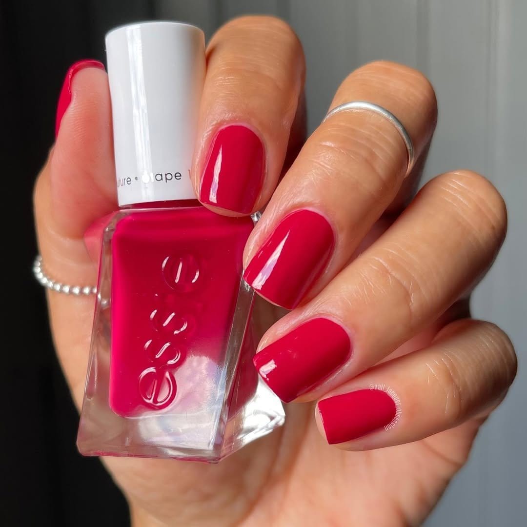 Red nails with chevron stripe patterns