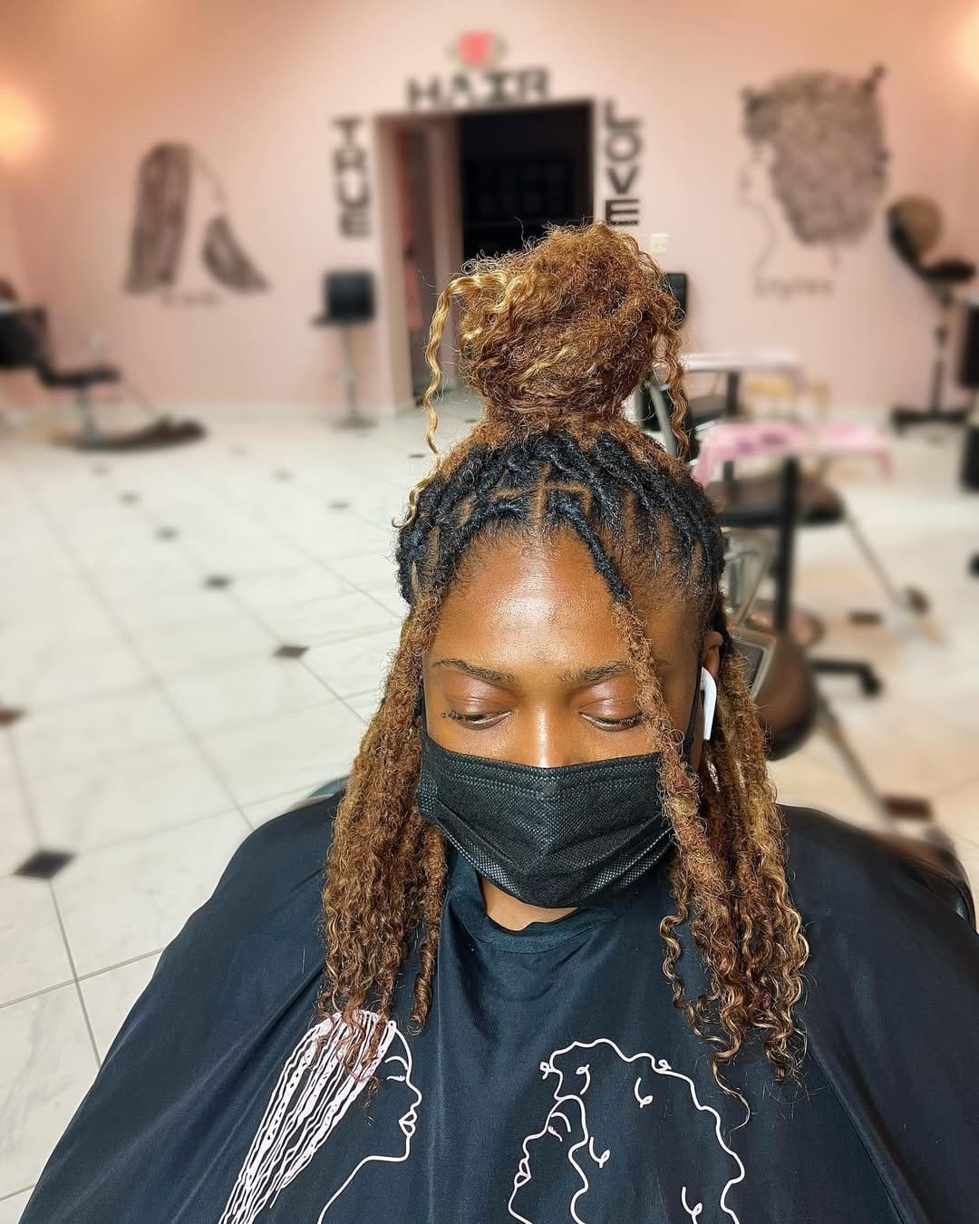 Short locs with vibrant color streaks