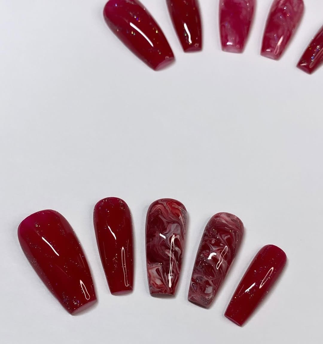 White marble effect nails with a marble backdrop