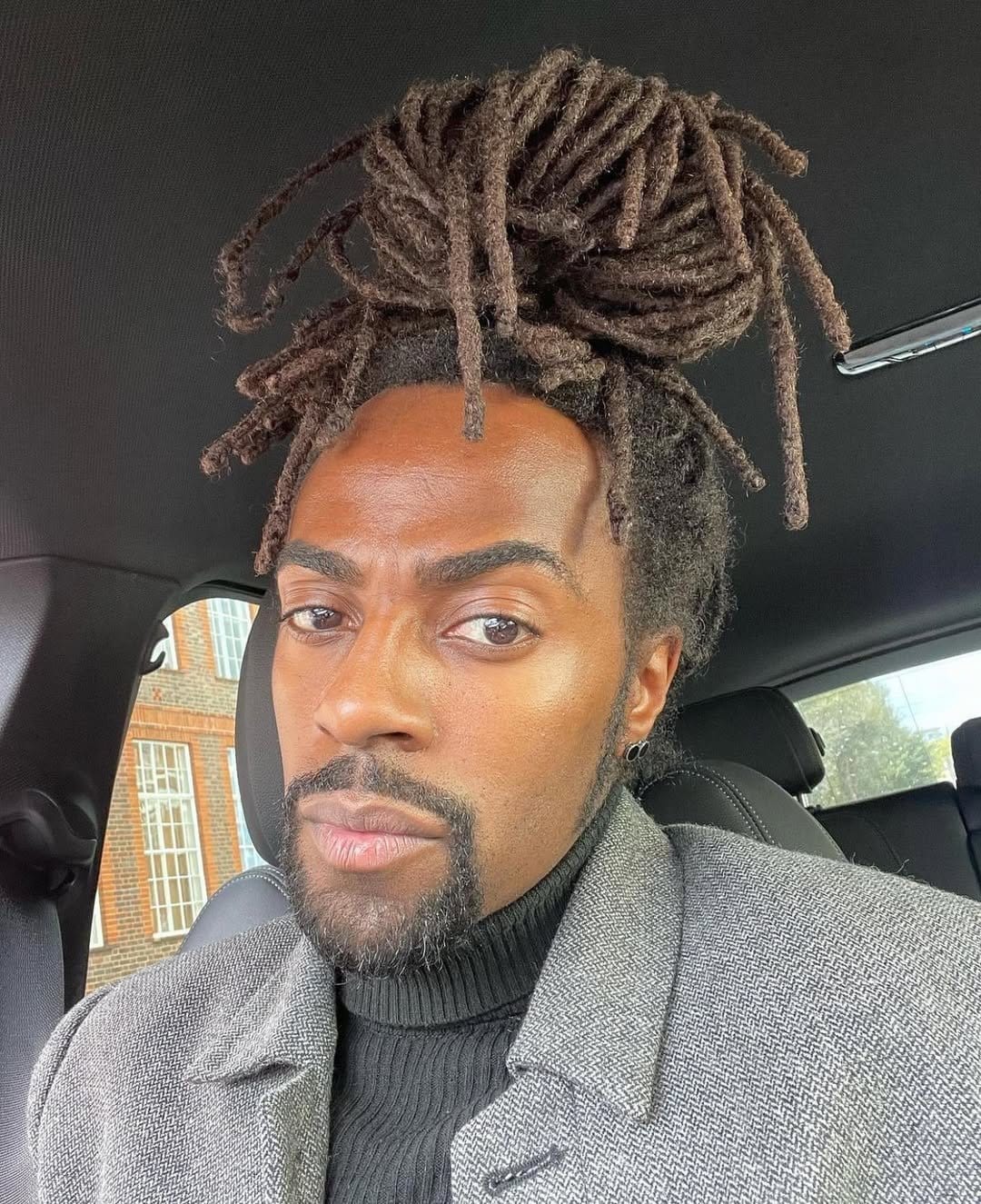 Casual messy bun with short locs